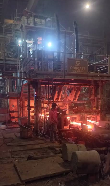 Hot steel moving through a casting line at the Mahrishi steel plant