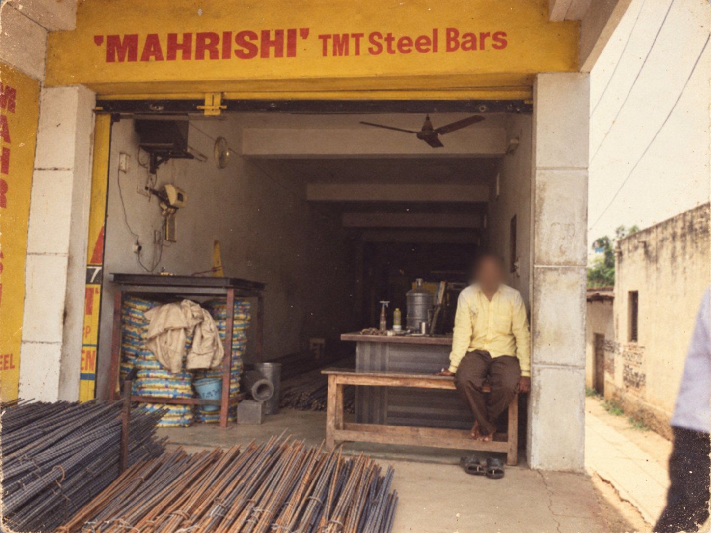 Mahrishi TMT distributor storefront with human faces blurred