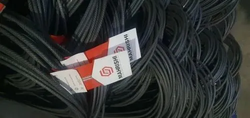 Bundles of steel bars carrying Mahrishi TMT labels